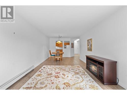 Living room to dining - 250 5 Street Se Unit# 313, Salmon Arm, BC - Indoor Photo Showing Other Room With Fireplace