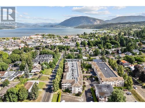 Ariel view of building - 250 5 Street Se Unit# 313, Salmon Arm, BC - Outdoor With Body Of Water With View