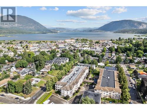 Ariel view of building - 250 5 Street Se Unit# 313, Salmon Arm, BC - Outdoor With Body Of Water With View