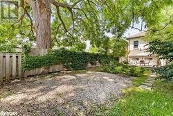 Gravel topped concrete parking pad - 