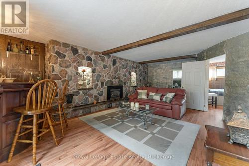 The basement rec room - 97 Dorena Crescent, South Bruce Peninsula, ON - Indoor Photo Showing Living Room With Fireplace