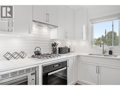 1308 Richter Street Unit# 107, Kelowna, BC - Indoor Photo Showing Kitchen With Double Sink With Upgraded Kitchen