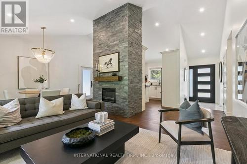 27 Treadgold Crescent, Toronto, ON - Indoor Photo Showing Living Room With Fireplace