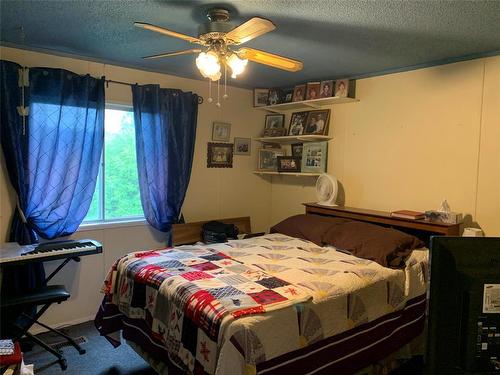 Plenty of room in the primary bedroom with a full wall closet. - 3 Reiland Bay, Gladstone, MB - Indoor Photo Showing Bedroom