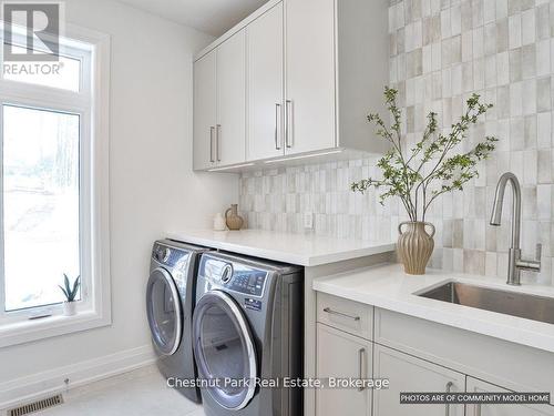 photos of similar condo - 18 Pine Needle Way, Huntsville (Chaffey), ON - Indoor Photo Showing Laundry Room