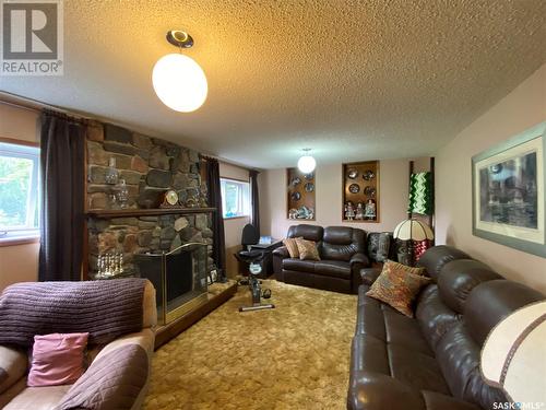 620 4Th Street, Eston, SK - Indoor Photo Showing Living Room With Fireplace