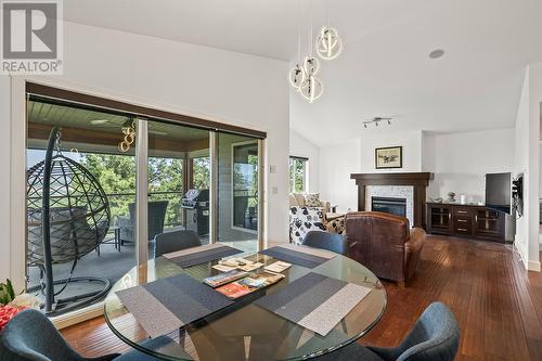 5318 Trickle Creek Drive, Kelowna, BC - Indoor Photo Showing Dining Room With Fireplace