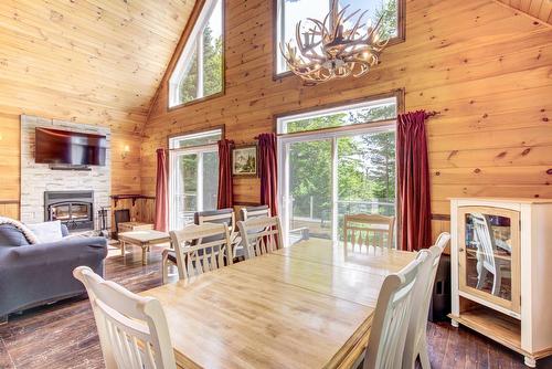 Dining room - 230 Rue Du Sommet, Entrelacs, QC - Indoor Photo Showing Dining Room With Fireplace