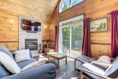 Living room - 230 Rue Du Sommet, Entrelacs, QC - Indoor Photo Showing Living Room With Fireplace