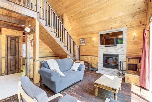 Living room - 230 Rue Du Sommet, Entrelacs, QC - Indoor Photo Showing Living Room With Fireplace