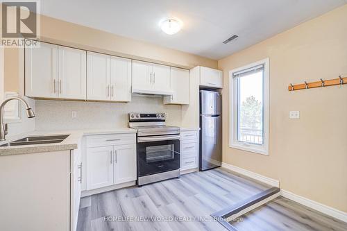 23 - 3895 Doug Leavens Boulevard, Mississauga, ON - Indoor Photo Showing Kitchen With Double Sink