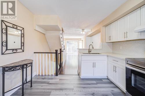 23 - 3895 Doug Leavens Boulevard, Mississauga, ON - Indoor Photo Showing Kitchen With Double Sink