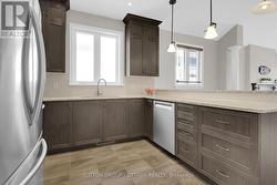 Chic kitchen with updated pendant lights - 