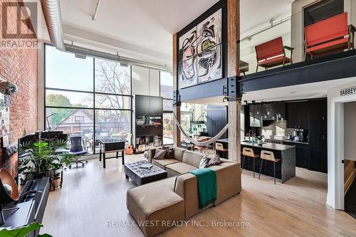 Great Room, Exposed Brick, Floor to Ceiling Window - 318 - 200 Stinson Street, Hamilton, ON - Indoor Photo Showing Living Room