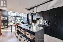 Designer kitchen, denim granite waterfall counter - 