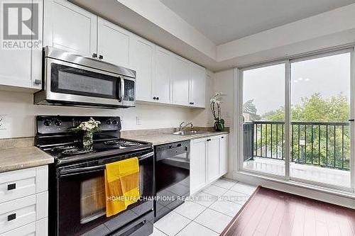 304 - 35 Strangford Lane S, Toronto, ON - Indoor Photo Showing Kitchen With Double Sink