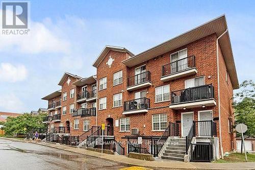 304 - 35 Strangford Lane S, Toronto, ON - Outdoor With Balcony With Facade