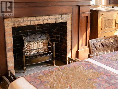 312 Latimer Street, Nelson, BC - Indoor Photo Showing Bedroom With Fireplace