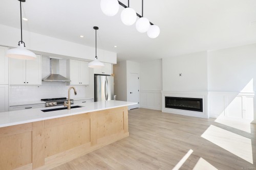 B-1369 Galerno Rd, Campbell River, BC - Indoor Photo Showing Kitchen With Fireplace With Double Sink With Upgraded Kitchen