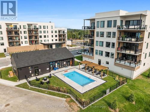 402 - 19B West Street N, Kawartha Lakes, ON - Outdoor With In Ground Pool With Balcony