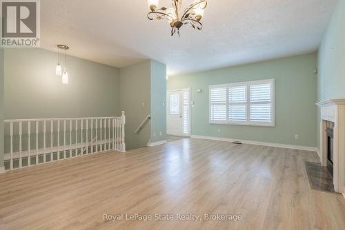 3 - 34 Southbrook Drive, Hamilton (Binbrook), ON - Indoor Photo Showing Other Room With Fireplace