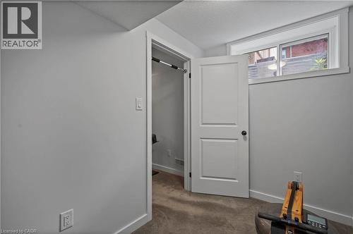 Hall featuring carpet floors and baseboards - 47 Gruhn Street, Kitchener, ON - Indoor Photo Showing Other Room