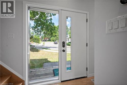 Doorway with baseboards and wood finished floors - 47 Gruhn Street, Kitchener, ON - Indoor Photo Showing Other Room
