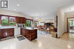 Kitchen featuring classic cherry wood cabinetry - 
