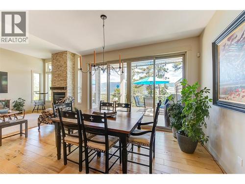 2191 Salerno Court, Kelowna, BC - Indoor Photo Showing Dining Room With Fireplace