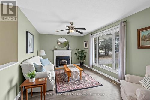 Wood Burning Fireplace in Living Room - 6481 Rideau Valley Drive N, Ottawa, ON - Indoor Photo Showing Living Room With Fireplace