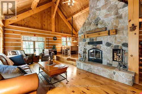 2275 Palmerston Lake, Frontenac (Frontenac North), ON - Indoor Photo Showing Living Room With Fireplace