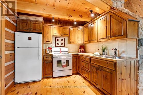2275 Palmerston Lake, Frontenac (Frontenac North), ON - Indoor Photo Showing Kitchen With Double Sink