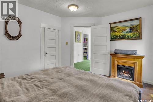 621 Main Street, Bruno, SK - Indoor Photo Showing Bedroom With Fireplace
