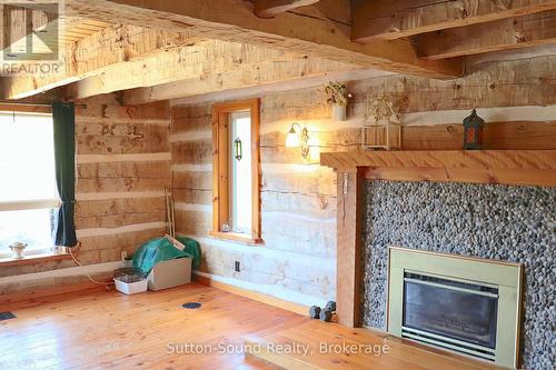 Gorgeous hand hewn log finish - 234491 Concession 2 Wgr Concession, West Grey, ON - Indoor With Fireplace