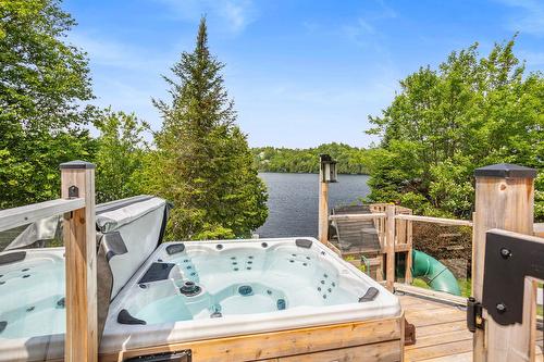 Hot tub - 851  - 853 Ch. Morgan, Saint-Adolphe-D'Howard, QC - Outdoor With Body Of Water