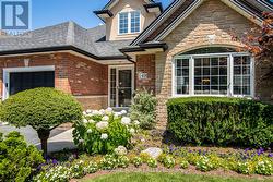 Lush front gardens & inground sprinklers - 