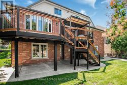 Large concrete patio with deck above - 