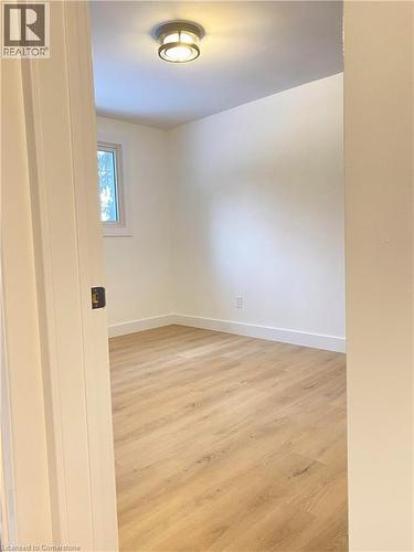 Empty room featuring light wood-type flooring and baseboards - 79 Inwood Crescent, Kitchener, ON - Indoor Photo Showing Other Room