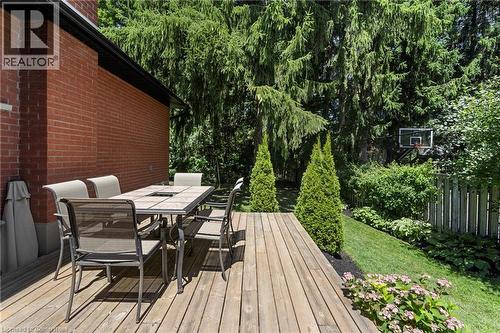 Wooden deck featuring outdoor dining space - 79 Inwood Crescent, Kitchener, ON - Outdoor With Deck Patio Veranda With Exterior