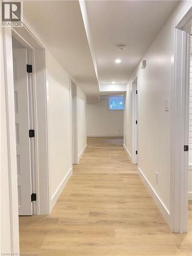 Hallway with light wood finished floors and recessed lighting - 79 Inwood Crescent, Kitchener, ON - Indoor Photo Showing Other Room