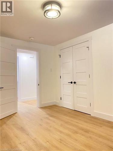 Unfurnished room with light wood-style floors - 79 Inwood Crescent, Kitchener, ON - Indoor Photo Showing Other Room