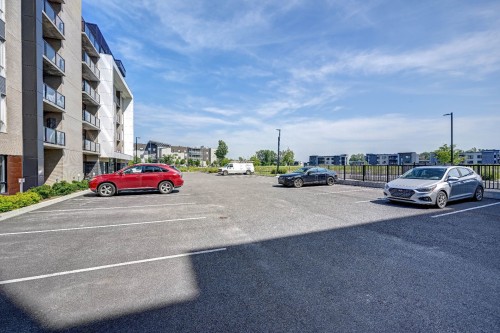 Stationnement - 104-980 Av. Pierre-Dansereau, Terrebonne (Terrebonne), QC - Outdoor