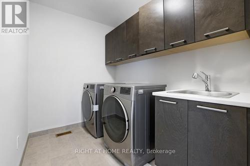 laundry oasis with a sink - 159 Rockmelon Street, Ottawa, ON - Indoor Photo Showing Laundry Room