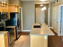 3313 Wilson Street Unit# 201, Penticton, BC  - Indoor Photo Showing Kitchen With Double Sink 