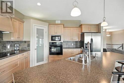 900 Water Ridge Crescent, Humboldt, SK - Indoor Photo Showing Kitchen With Double Sink