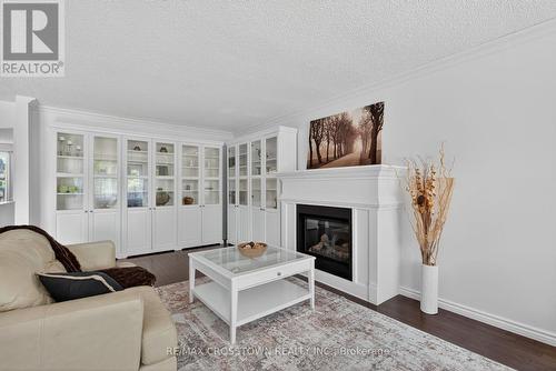 2 Birchmount Circle, Wasaga Beach, ON - Indoor Photo Showing Living Room With Fireplace