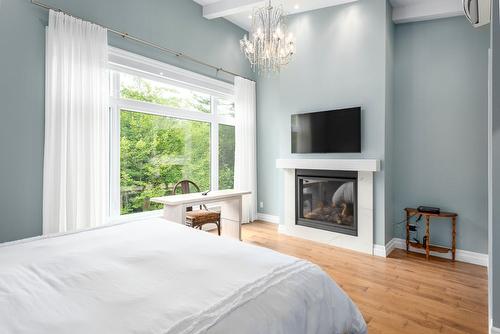 Bedroom - 2318 Imp. Des Trilles, Magog, QC - Indoor Photo Showing Bedroom With Fireplace