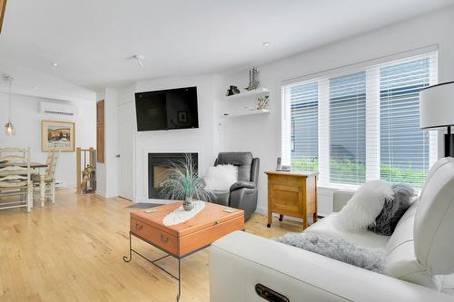 Living room - 66 Av. Guindon, Saint-Sauveur, QC - Indoor Photo Showing Living Room With Fireplace