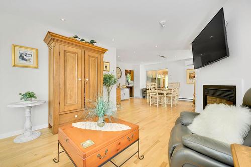 Living room - 66 Av. Guindon, Saint-Sauveur, QC - Indoor Photo Showing Living Room With Fireplace
