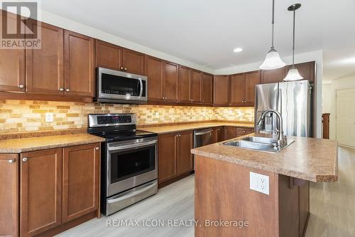 Nice tiles back splash. - 3190 Pomeroy Lane, London South (South V), ON - Indoor Photo Showing Kitchen With Double Sink